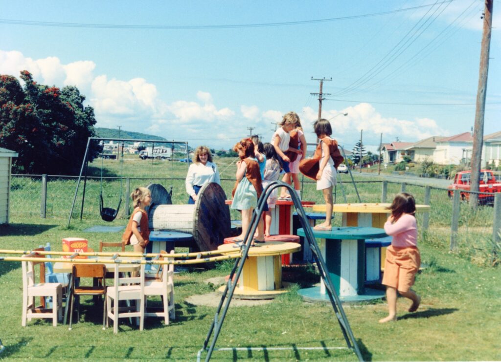 Children playing on outdoor equipment at Blaketown Playcentre, Greymouth, in 1987