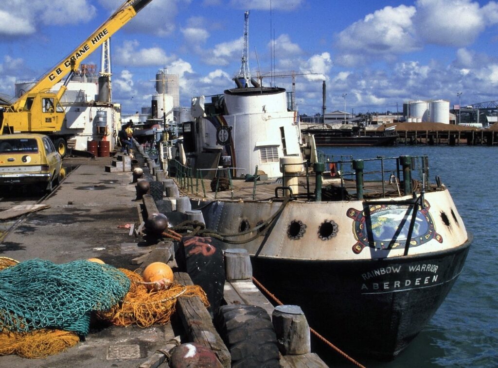 Rainbow Warrior moored at a wharf in Auckland in 1985.